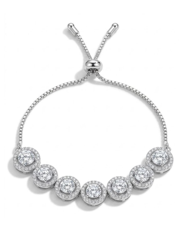 Silver bracelet with round gemstones on a white background