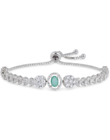 Silver bracelet with a central green gemstone on a white background