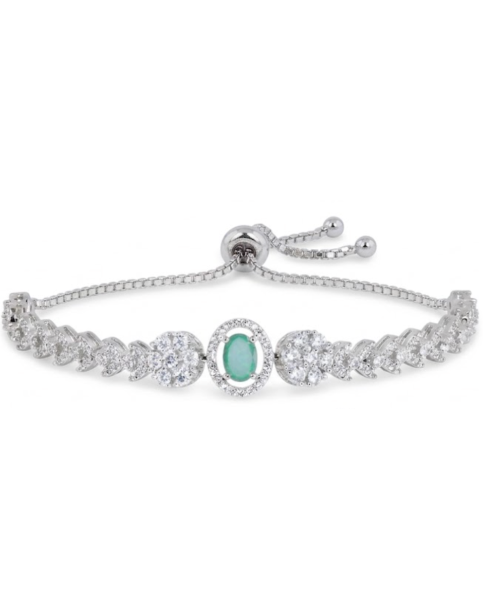 Silver bracelet with a central green gemstone on a white background
