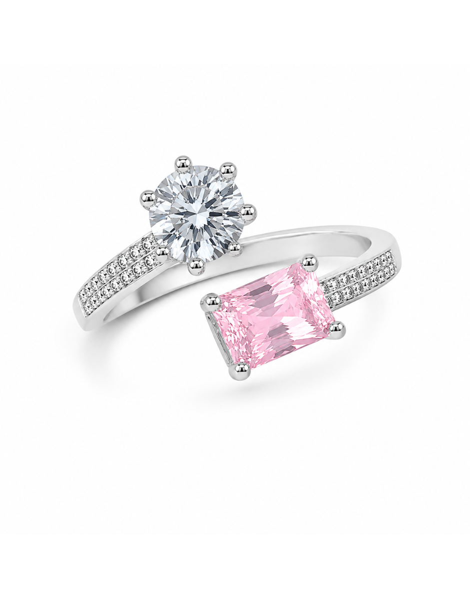 Silver ring with pink gemstone and round diamond on a white background