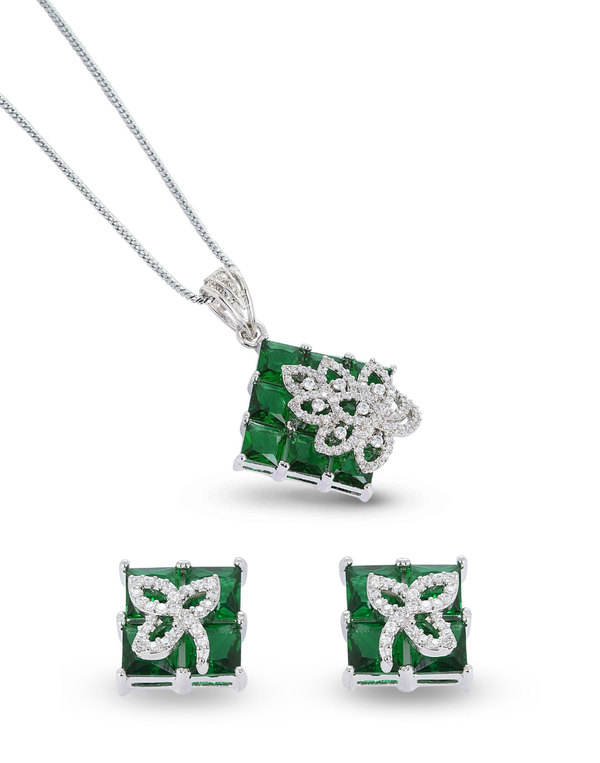 Jewelry set with emerald green gemstones and silver accents on a white background