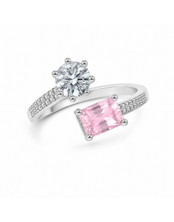 Silver ring with pink gemstone and round diamond on a white background