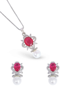 Jewelry set with red gemstones and pearls on a white background
