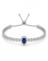Silver bracelet with a blue gemstone on a white background