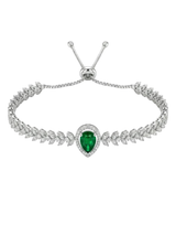 Silver bracelet with a heart-shaped green gemstone on a white background