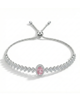 Silver bracelet with a pink gemstone on a white background