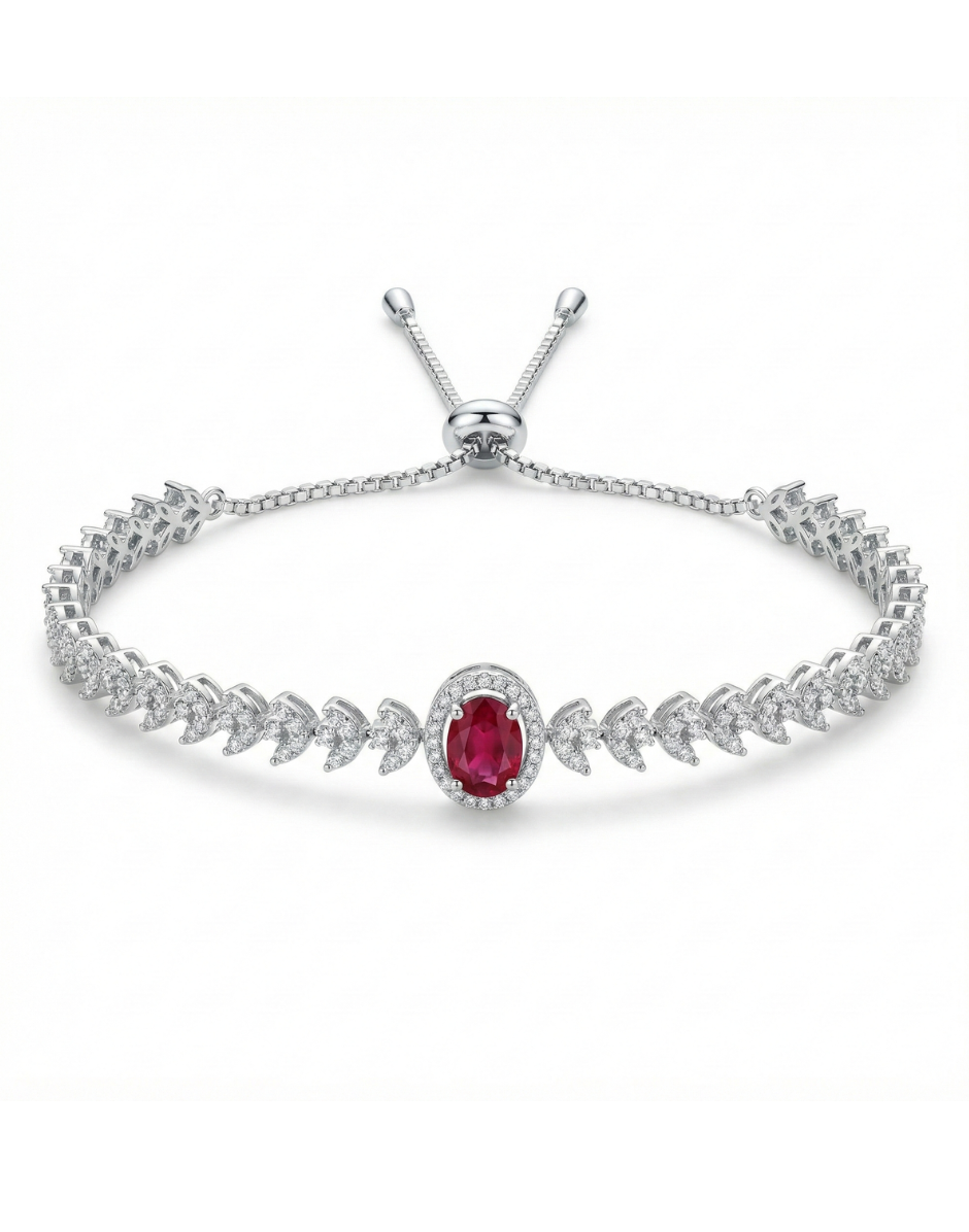 Silver bracelet with a red gemstone on a white background